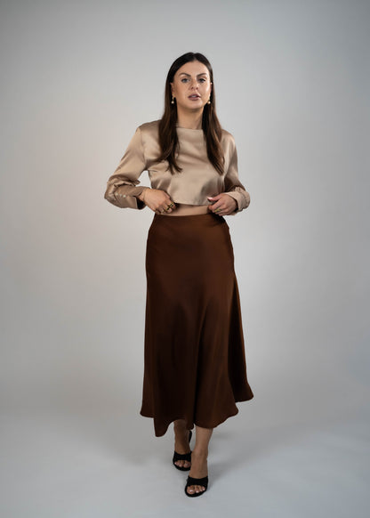 Elegant brown satin maxi skirt that’s easy to match with any outfit. Perfect for creating a sophisticated and versatile look