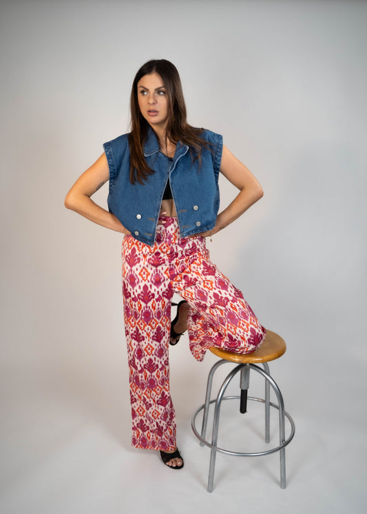 Elegant pink high-waisted flowy pants made from silky fabric, perfect for a chic and comfortable look. Ideal for both casual and formal outfits. Shop now for stylish and versatile wardrobe essentials